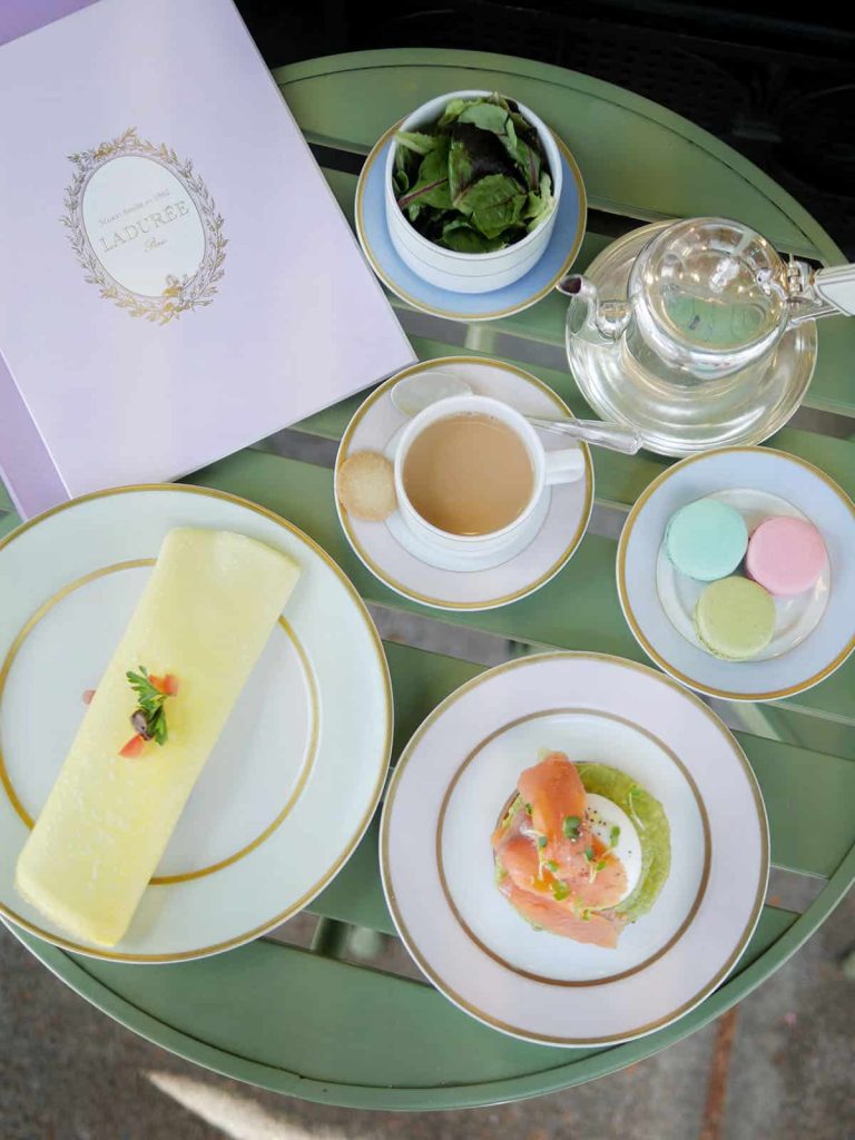 A flatlay bird's eye view of different brunch dishes on a table.