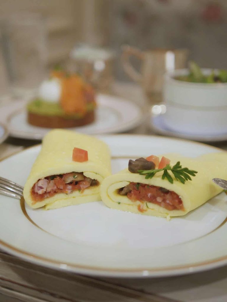 Cross section of an omelette on a dish. 