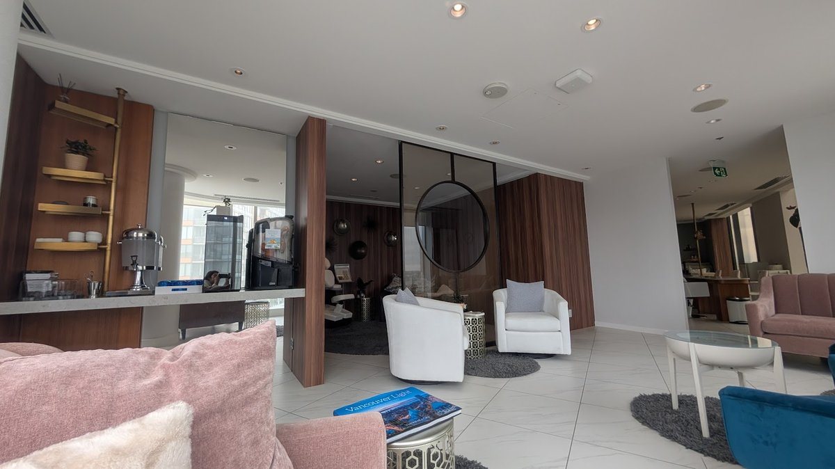 Waiting area of the JW spa with lounge chairs and snack station. 