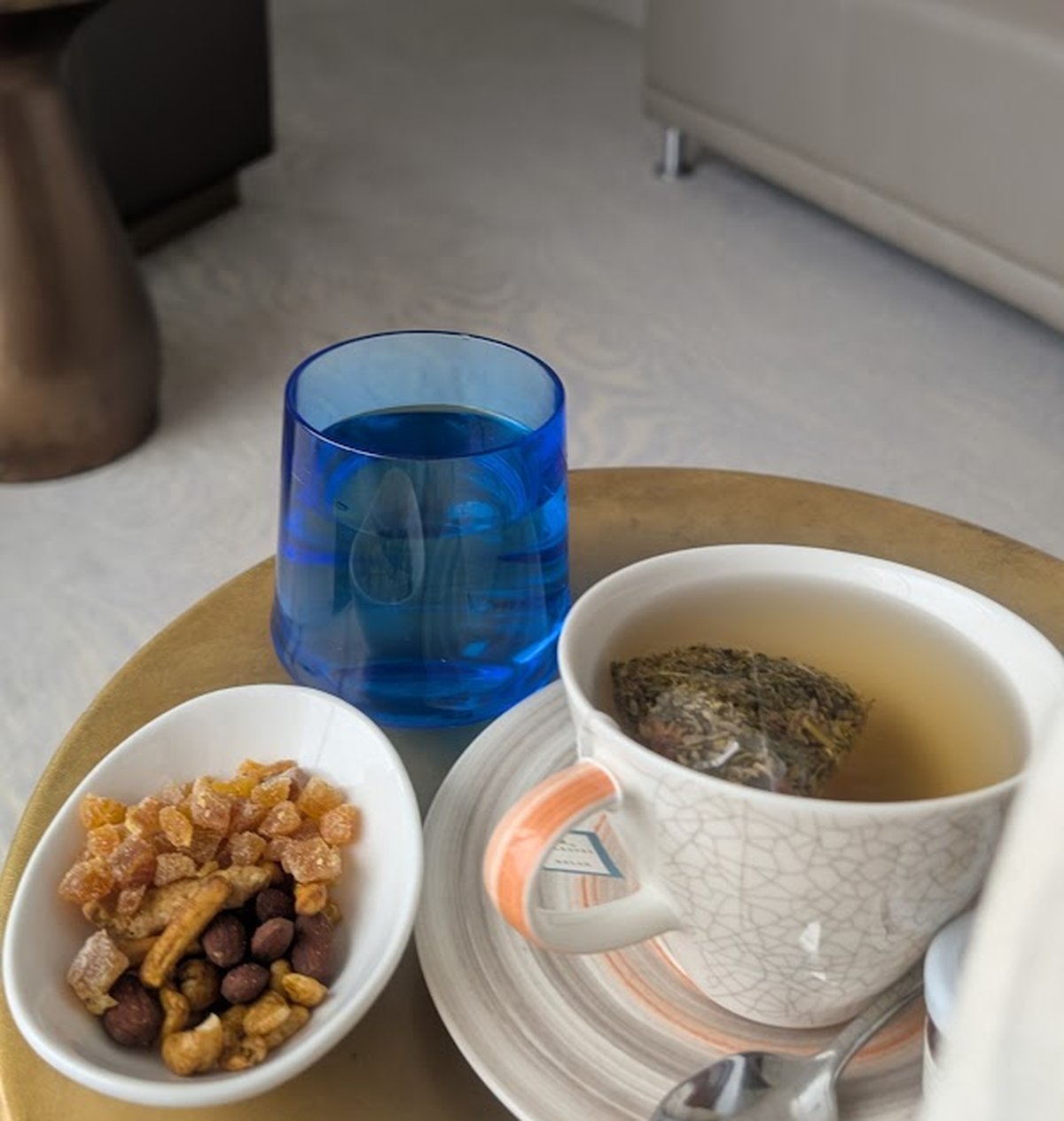 Close up shot of snack mix and herbal tea. 